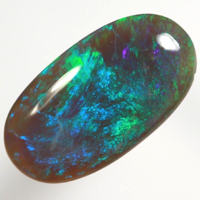 SOLID BLACK CRYSTAL OPAL Rolling flashes of green and turquoise purple fire